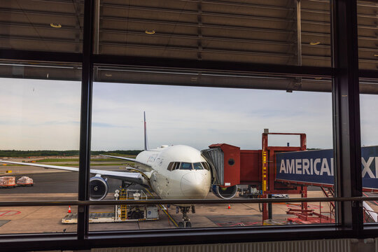 Close-up of view of Delta Airlines plane connected to boarding bridge at Swedish airport before passengers board. Arlanda. Sweden. 