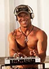 A Disc Jockey Playing Music At Explora Beach Bar; Tarifa, Cadiz, Andalusia, Spain