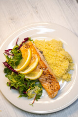 salmon fillet with couscous and vegetables salad