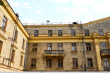 View of the facade of typical soviet building, the construction of the 1950s in the style of Stalin...