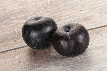 Two ripe sweet black plums