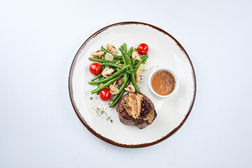 grilled steak with vegetables and sauce