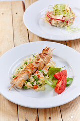 chicken kebab with rice and vegetables