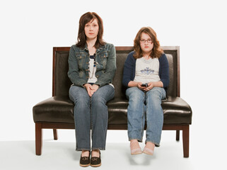 Mother And Daughter Ignoring Each Other; Edmonton, Alberta, Canada