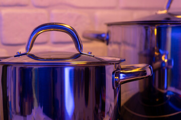 Metal Pot on induction hob in modern kitchen