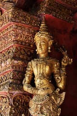 Fototapeta na wymiar Statue In Wat Phra Singh Temple; Chiang Mai, Thailand