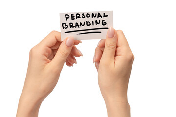 Personal branding text on a card in woman hand isolated on white background.
