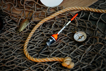 Close up float lay on fishing nets on wooden background