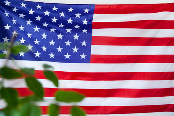 Obraz premium USA flag waving in the wind on a white background.