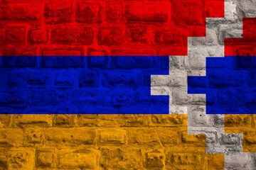 colored national flag Nagorno-Karabakh sovereignty and independence as nation on brick wall,...