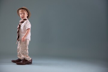 Toddler With Big Shoes And A Hat; Jordan, Ontario, Canada
