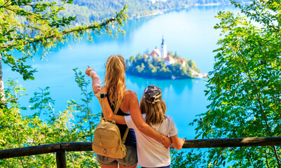 Mother and son enjoying panoramic view of Bled lake in Slovenia- travel, tour tourism, vacation in...