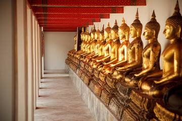 Seated Golden Buddha Statues In A Row At Wat Pho, Temple Of The Reclining Buddha; Bangkok, Thailand