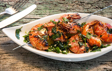 tasty fresh shrimp skewers on plate