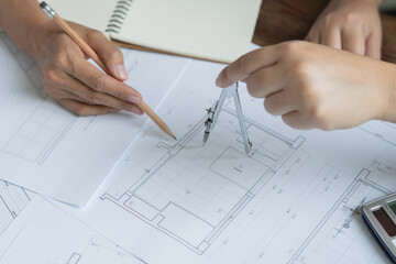 Architecture drawing on architectural Creative project business architecture building construction&nbsp;Industrial engineering Achievement Planning Design on blueprint Teamwork