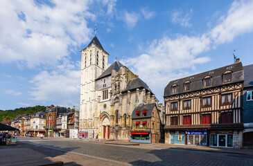 PONT-AUDEMER, FRANCE: Saint Ouen Church and empty main street (Rue de la République)