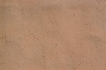 Plastered wall surface with cracks