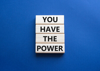 You have the Power symbol. Concept words You have the Power on wooden blocks. Beautiful deep blue background. Business and You have the Power concept. Copy space.