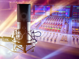 Microphone in sound recording studio. Professional radio microphone. Mixing console for dj....