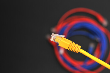 Network internet cable isolated on black background