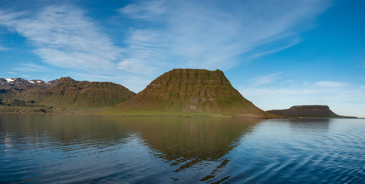 Dramatic view of the Kirkjufell mountain, Grundarfjörður on the northshore of the Snæfellsnes peninsula in the west of Iceland. - Powered by Adobe