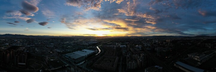 Stunning  Aerial Panoramic View of Bogotá Skyline at Sunset – Golden Hour Casting Warm Hues Over...