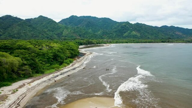 Captivating Drone Footage of Tropical Coastline Journey &ndash; Soaring Over Palm Trees and Rugged Mountains on the Left, Azure Sea Stretching to the Horizon on the Right p2