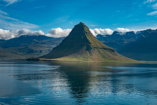 Dramatic view of the Kirkjufell mountain, Grundarfjörður on the northshore of the Snæfellsnes peninsula in the west of Iceland. - Powered by Adobe