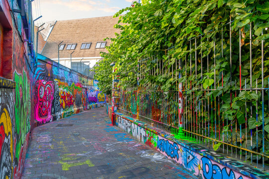 General view of Werregarenstraatje , or Graffiti Street, a cobbled alleyway whose walls are covered in vibrant street art and graffiti by local artists, in Ghent Belgium on August 18 2023.