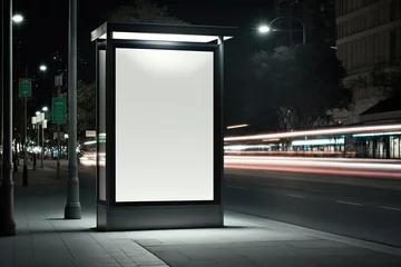 Fotobehang Mockup - Leere Reklame und beleuchtete Werbetafel am Busbahnhof in der Stadt.  © Marco