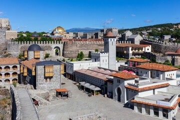  Akhaltsikhe (Rabati) Castle courtyard, medieval fortress in Akhaltsikhe, Georgia with traditional Georgian wooden balconies, fortress walls and mosque golden dome.