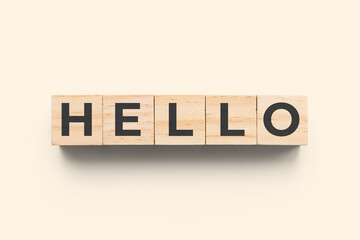 Hello wooden cubes on beige background © epsilomo