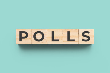 Polls wooden cubes on blue green background