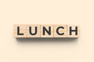 Lunch wooden cubes on beige background
