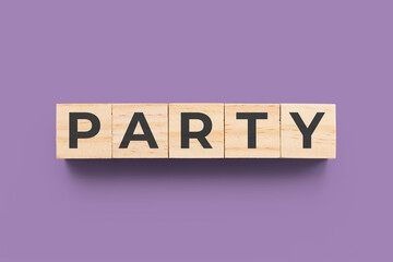 Party wooden cubes on purple background