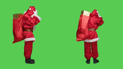 Saint nick with migraine carries sack, trying to deliver gifts boxes to children on time for...