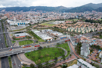Dynamic Aerial View of Bogotá's Bustling Streets – Blurry Vehicles in Motion Under a Radiant Sun...