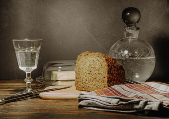Still life with natural products: alcohol, eggs, bread and butter, stylized as antique - 649947668