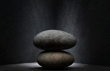 stones for the podium on a dark gray background. black, gray natural stones with texture for...