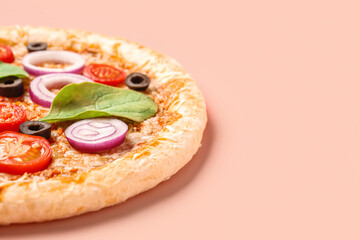Tasty pizza with basil and tomatoes on pink background
