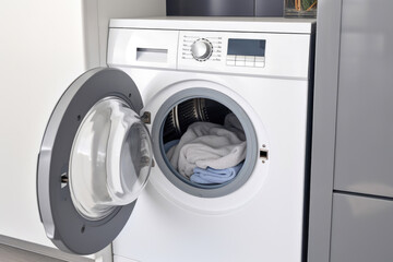 Frontal View of Washing Machine with Linens
