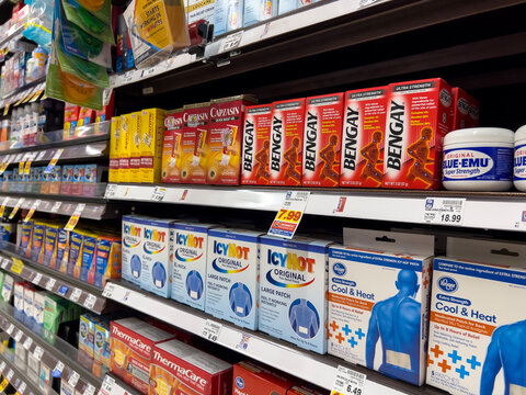 Seattle, WA USA - circa March 2023: Wide view of pain relief products for sale inside a QFC grocery store.