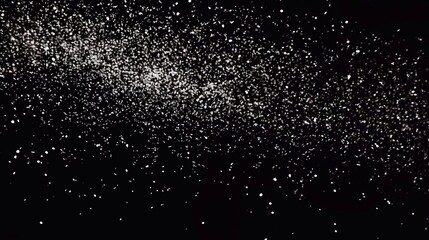 White snow on a black background. Snowflakes fly in the air.