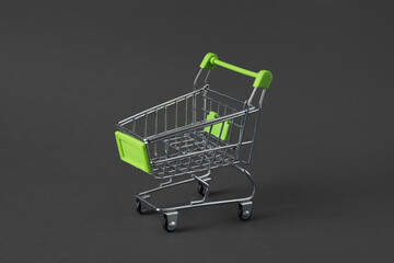 Shopping cart on grey background