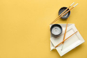 Chinese tableware on yellow background