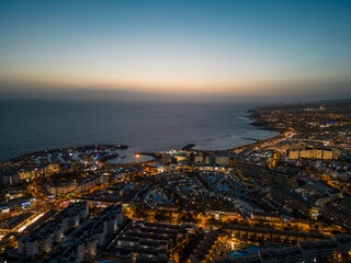 Fototapeta na wymiar aerial view of illuminated light night city with ocean shore, Tenerife, Canary