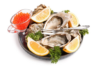 Plate of tasty oysters with lemon and red caviar on white background