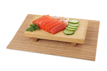 Delicious sashimi set of salmon and shrimps served with cucumbers and parsley isolated on white