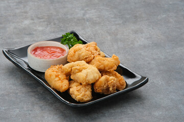 Crispy chicken fillets (ayam goreng tepung) with chilli sauce
