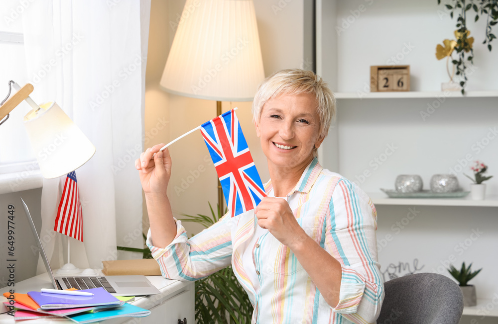 Poster Mature woman with UK flag learning English language online at home